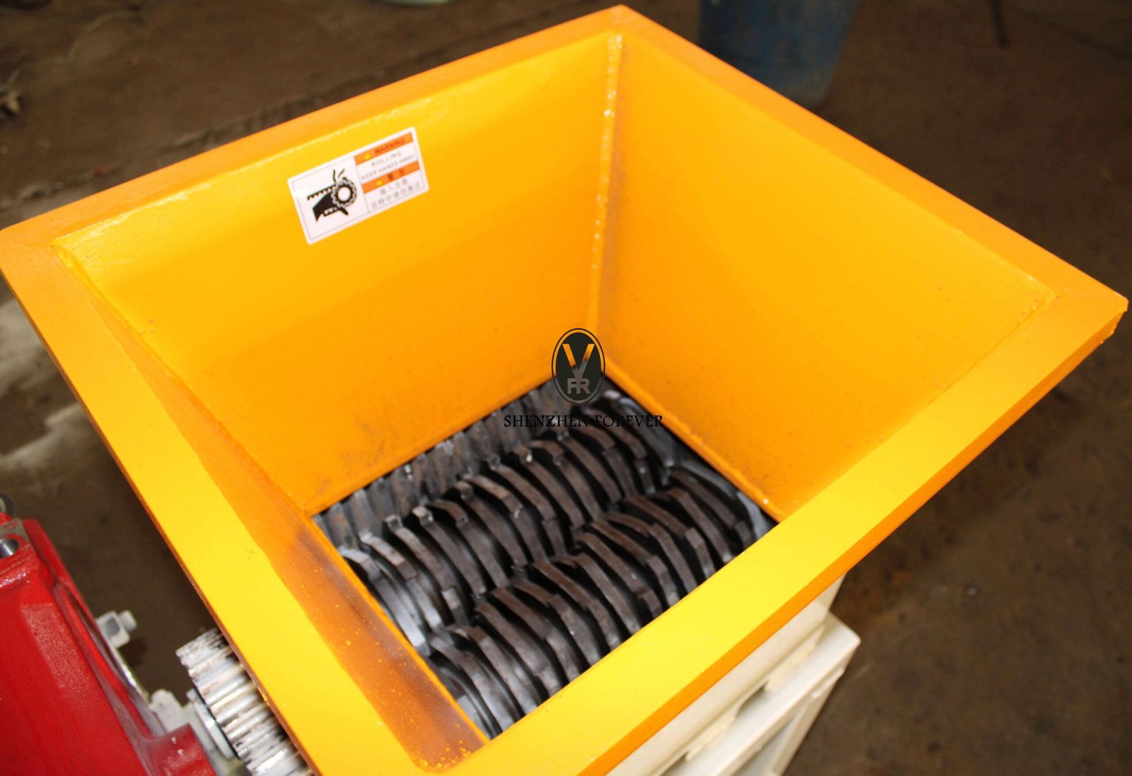 Industrial shredding machine processing Tetra Pak composite packaging materials in recycling facility